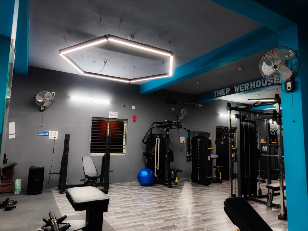 Spacious gym with mirrors and weights